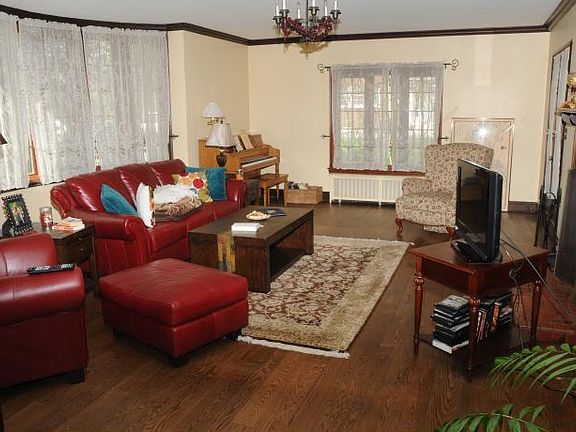 living room with wood burning fireplace