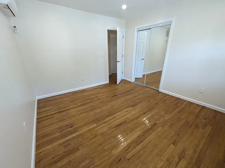 Second bedroom with mirror closet