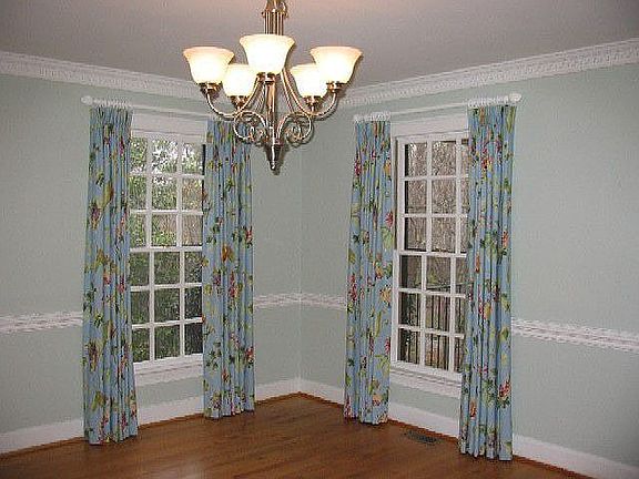 Formal dining room with extensive moldings