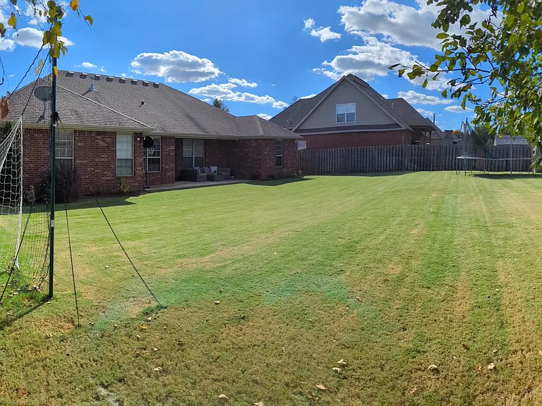 Large backyard with reflector lights.