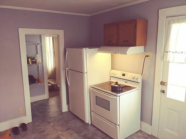 Kitchen looking into pantry and dining room