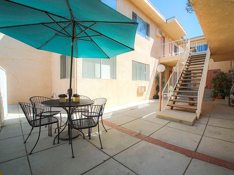Courtyard picnic space adjacent to solar heated pool.