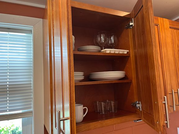 Fully furnished with dishes and cookware.