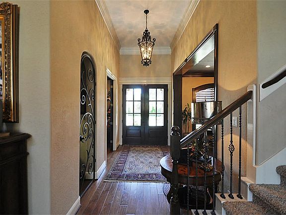 Beautiful foyer! Updated light fixture and designer paint.