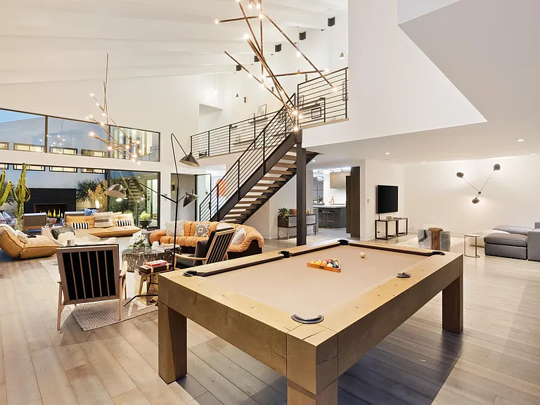 The large pool table, perfectly placed in the home.