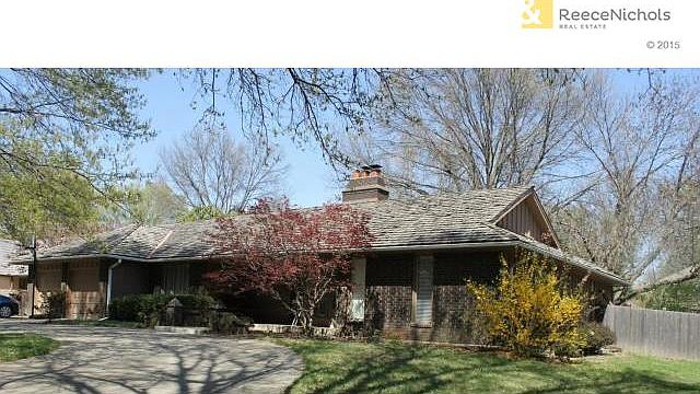 Fantastic curb appeal!  Brick trim, circle drive, covered front