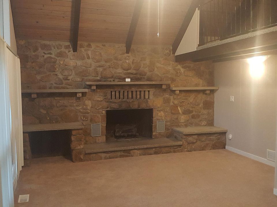 Huge stone fireplace w/ gas logs. Vaulted ceilings