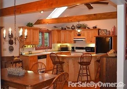 Vaulted beamed ceilings
						:
						Kitchen and dining room are adorned with vaulted ceilings with beams