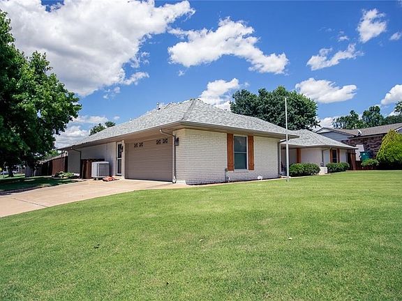 Side entry garage.  Shows backyard access on this corner lot as well.