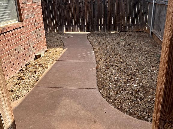 Back walk leading to alley.