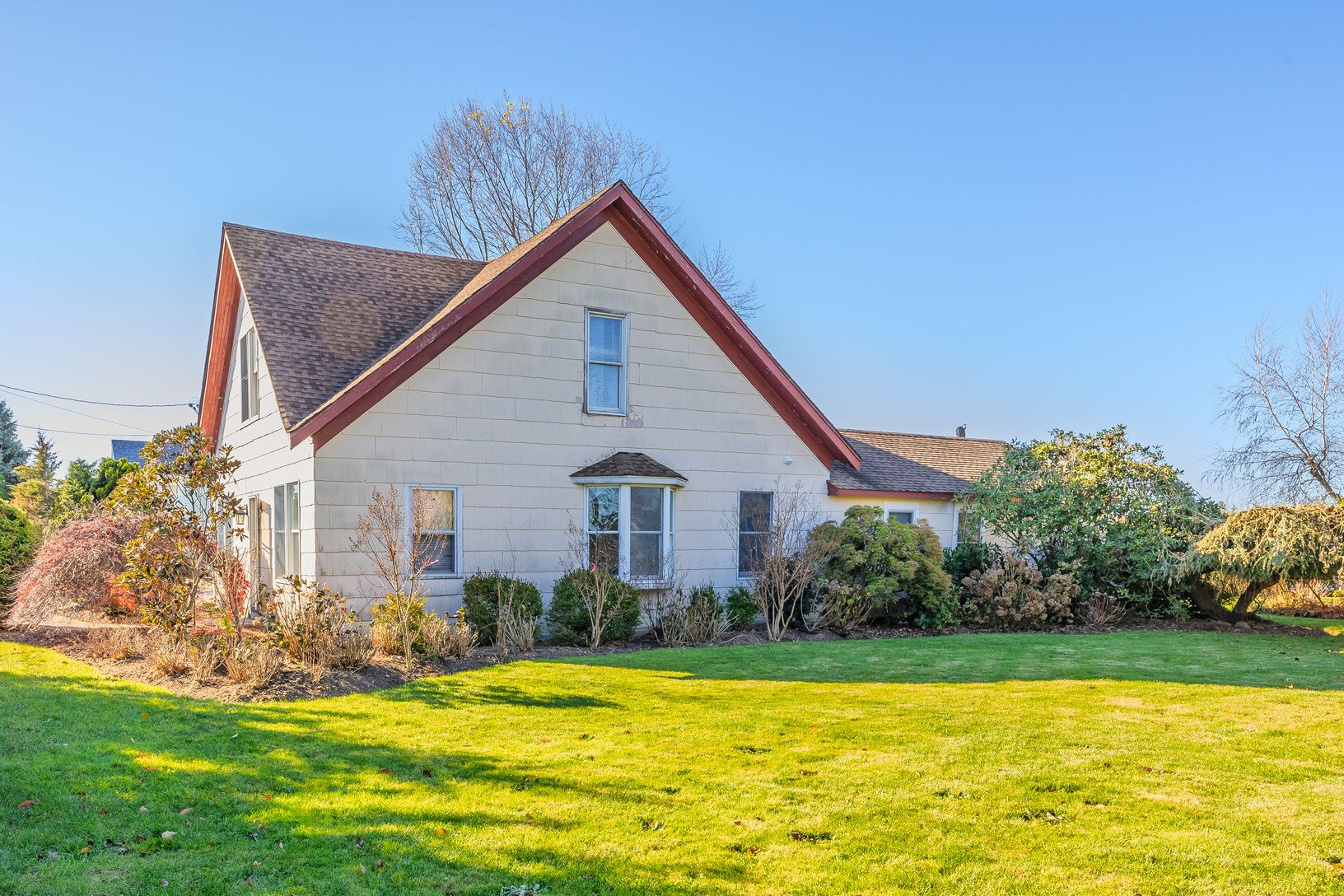 Main house with large grassy side yard