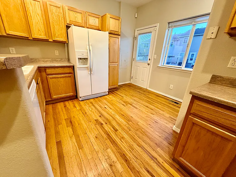 Another perspecitve of kitchen showing parking lot entry.