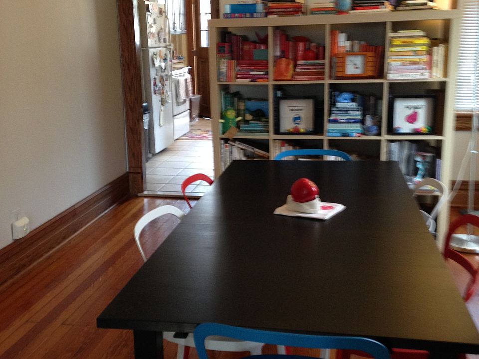 View of dining room, looking into kitchen