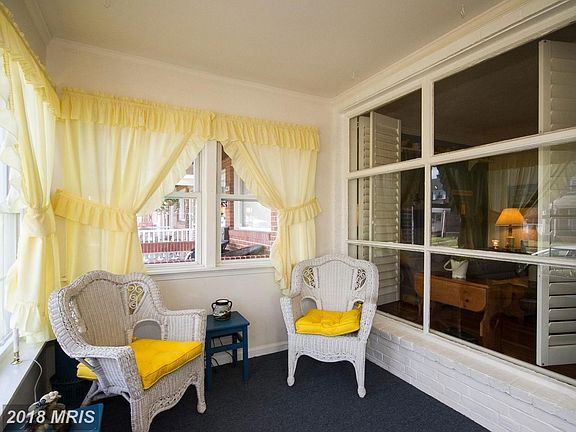 Enclosed front porch- Look at those windows!