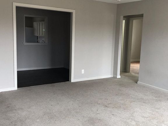 Front living area/dining area/entrance to bedrooms