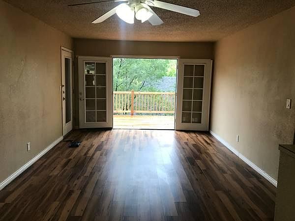 French doors opening to deck from living room