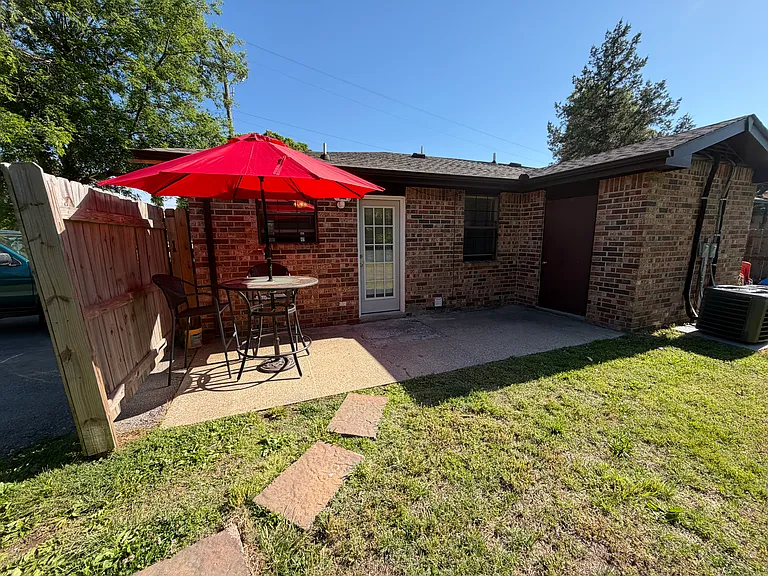 Private patio with storage shed