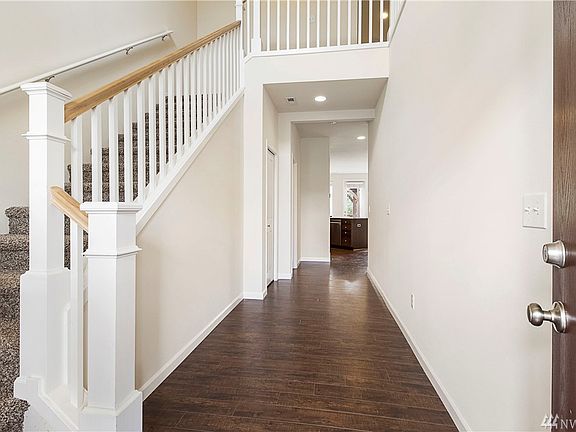 Beautiful open railing and long hallway as you enter.