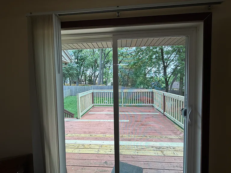 Sliding glass door looking out into the deck
