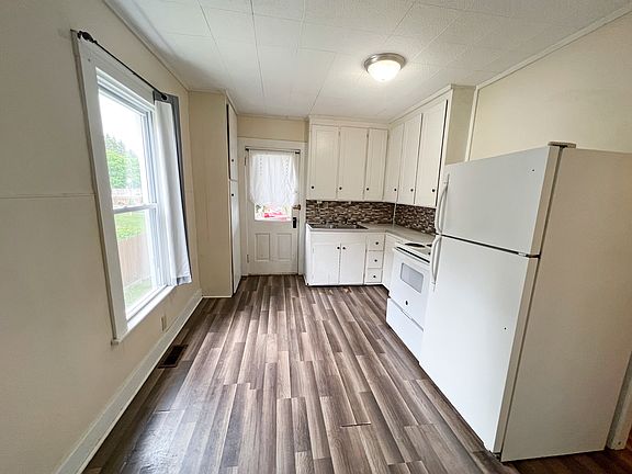 Bright and airy Kitchen with door leading to the Rear Deck