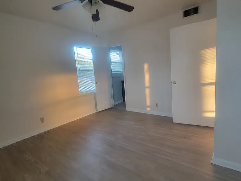 Master bedroom with master bath at far end.