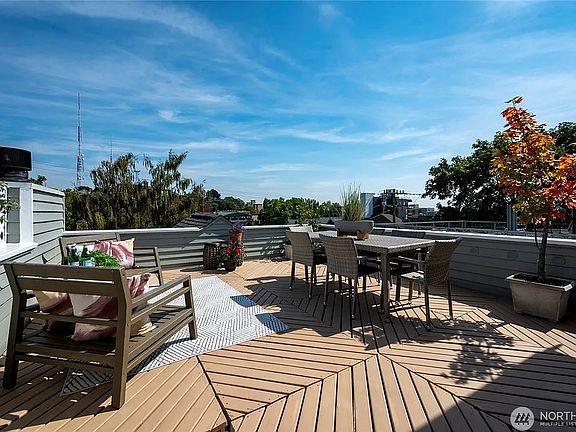 Rooftop deck with city and Mt. Rainer view.
