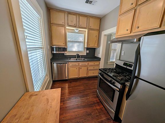 Galley Style Kitchen includes Stove, Refrigerator, Microwave, Dishwasher