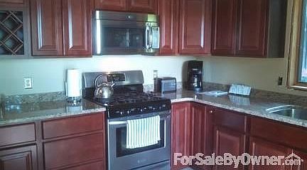 New Kitchen
						:
						Hardwood Cabinets and Granite Counters, Tile floors.