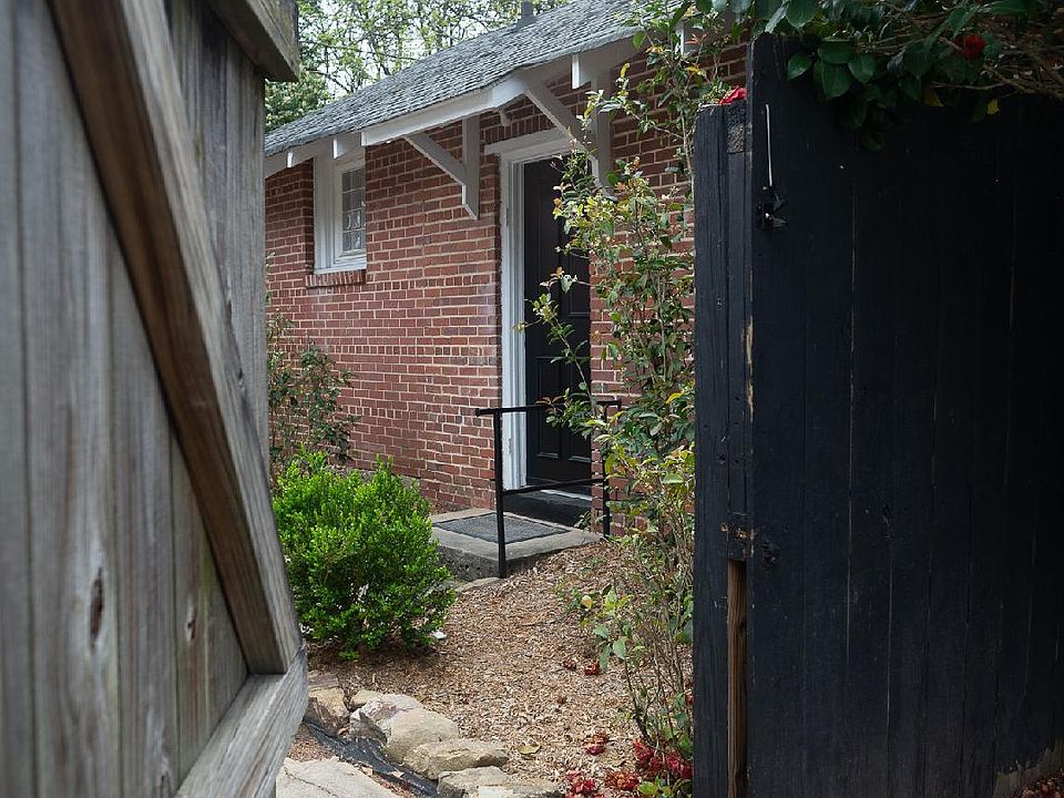 Entrance to back yard and cottage door.