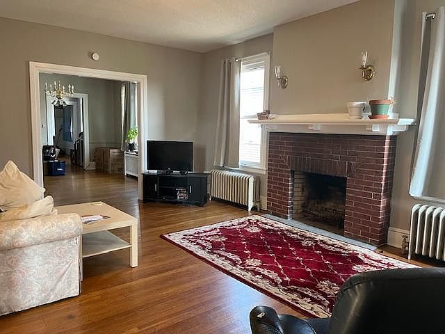 Livingroom with working fireplace and entry to formal dining room