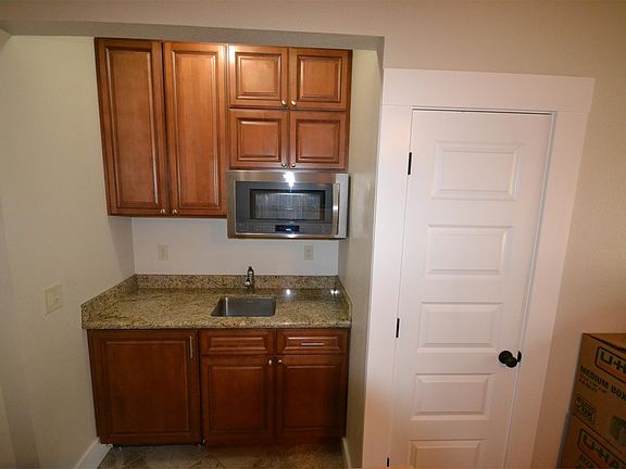 Kitchen includes microwave/oven. Cooktop in drawer. Garbag