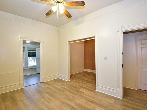 bedroom with den and walk-in closet