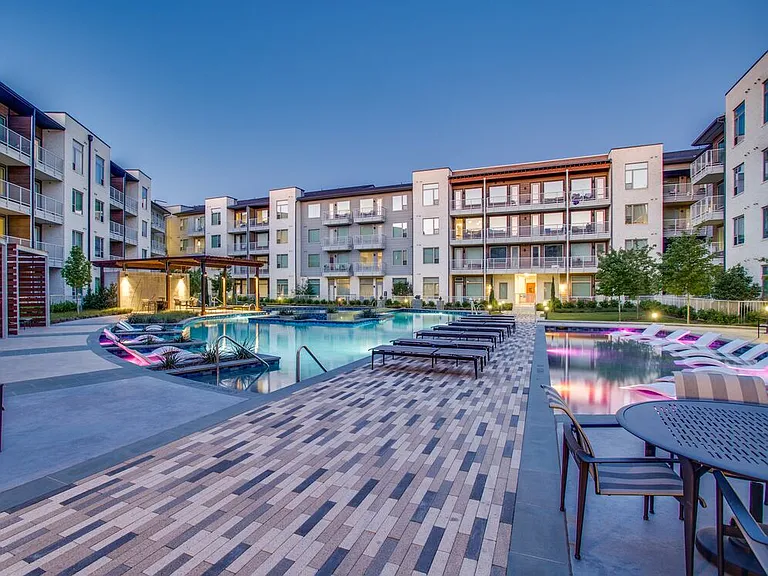 Pool and sundeck with seating areas