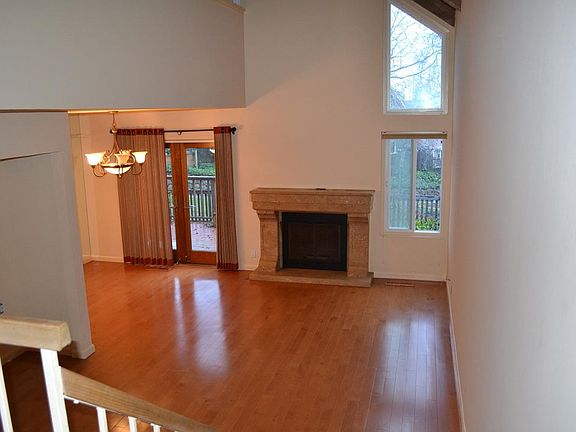 Living room with marble fireplace.