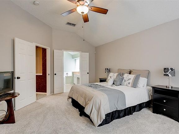 View from master bedroom. French doors lead to master bath. Just beyond the entry door is a decorative art niche alcove.