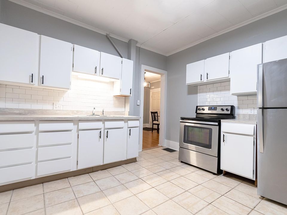 Kitchen facing stainless appliances and sink.