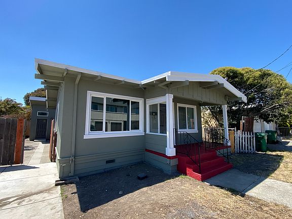 Front of house with parking space.
