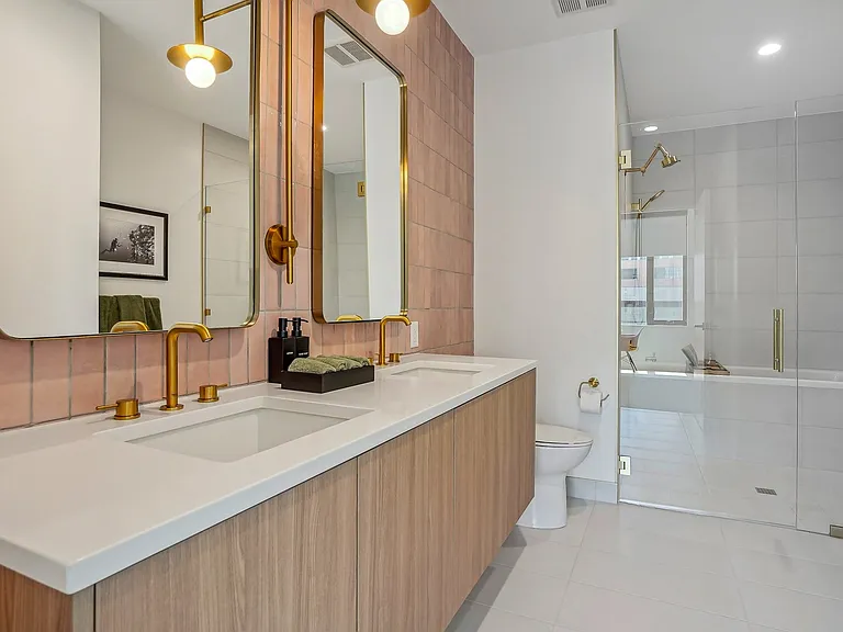 Luxurious bathroom with tub/shower combo and dual undermounted sinks