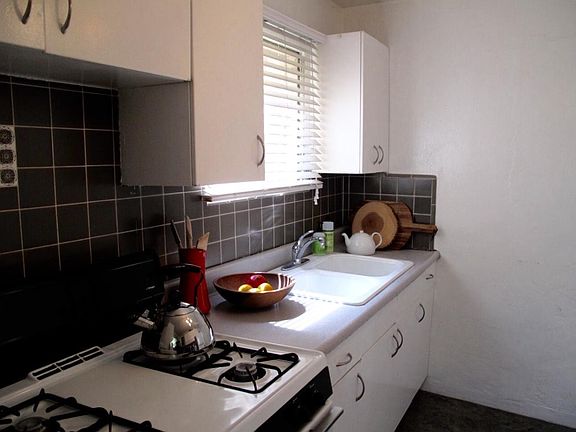 Kitchen with Gas Range and Laundry
