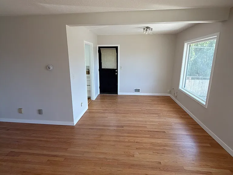 Dining area - Door to kitchen and outside door to side of unit.