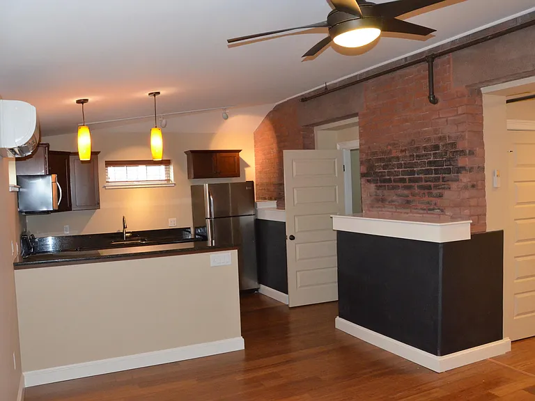 Living room and entry closet to kitchen