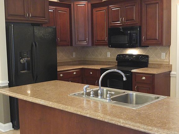 Spacious kitchen with breakfast bar.