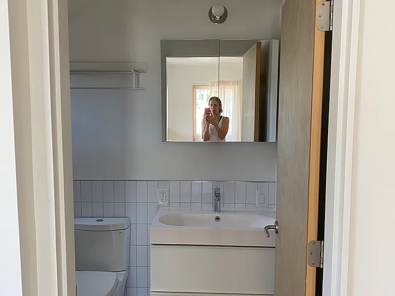 Second full bathroom with deep tub and shower.