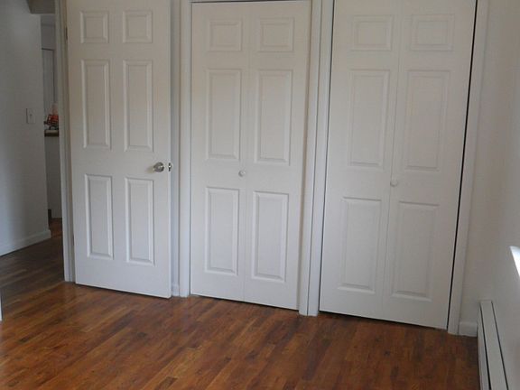 Bedroom with hardwood floors