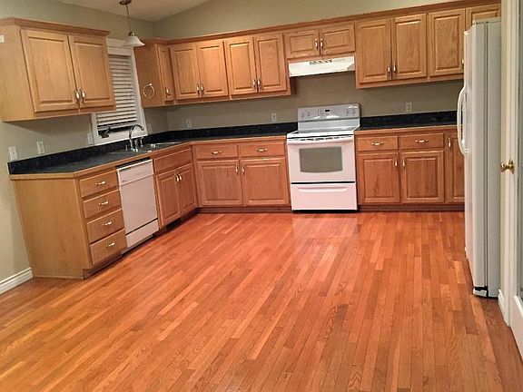 Large maintenance free deck looks out onto the flat back yard.  Kids will have a ball in the amount of room they have to run and play. Walk out from the Master Bedroom right onto the deck or enter through the French Doors from the Dining Room.