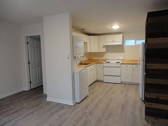 View of the kitchen and bath entry from the living room.