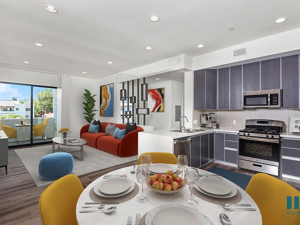Open-Concept Kitchen, Dining, and Living Room with Patio