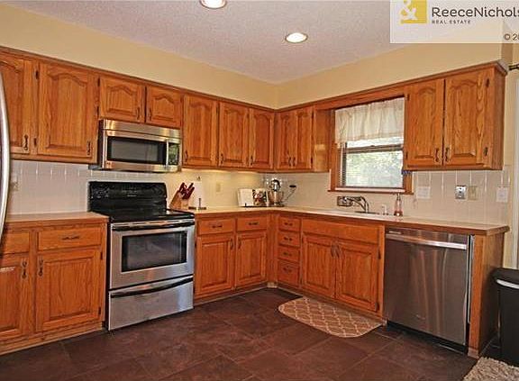 Stainless Steel Appliances & Dark Slate Tiles