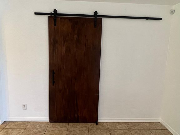 Barn door entrance to master suite