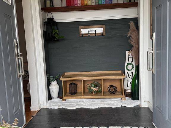Entryway into the home featuring double front doors.